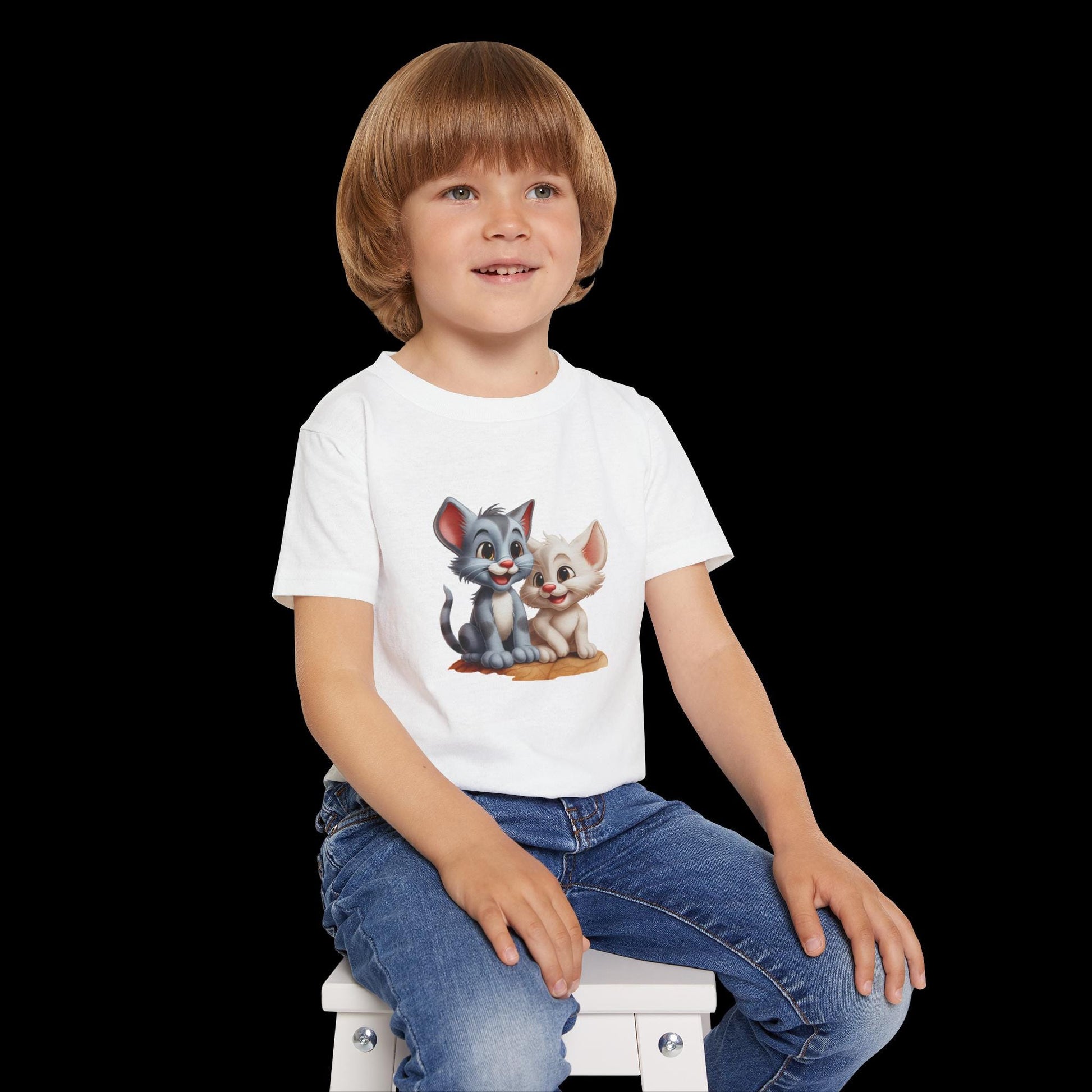 Child wearing a white t-shirt with cartoon characters on a white background